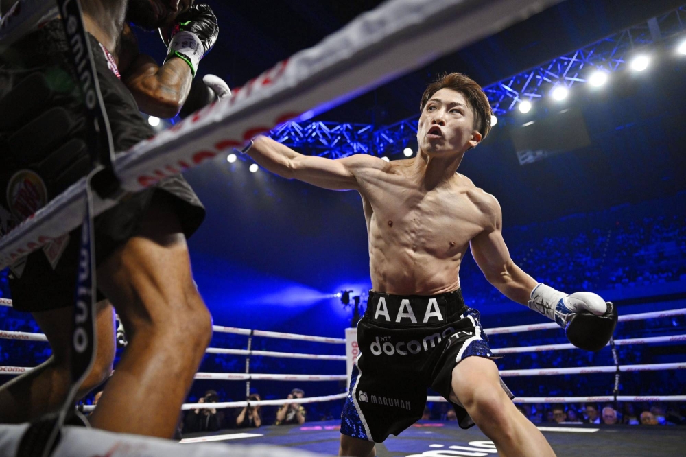 Naoya Inoue throwing punches during a game